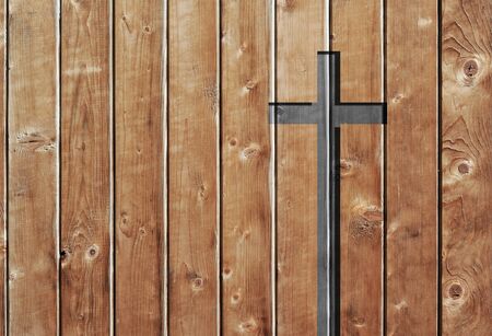 Brown old christian religion symbol cross shape as sign of belief on a grungy textured church wall or rustic aged background or backdrop, copy space for conceptual spirituality or resurrection designの写真素材