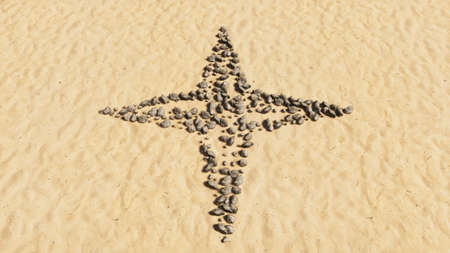 Concept conceptual stones on beach sand handmade symbol shape, golden sandy background, navigation compass. sign A 3d illustration metaphor for travel, adventure, exploration, journey and  progressの写真素材