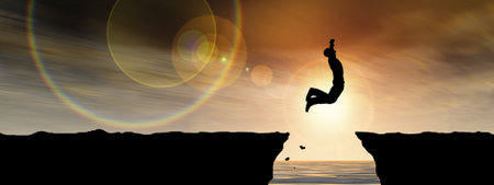 Concept or conceptual young man, businessman silhouette jump happy from cliff over water gap sunset or sunrise sky background, metaphor to freedom, nature, mountain, success, free,の写真素材