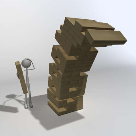 a figure is playing wooden blocks and made the last moveの写真素材