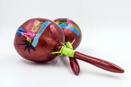 Two Cross Wooden Mexican Maracas Isolated on White Background.の写真素材