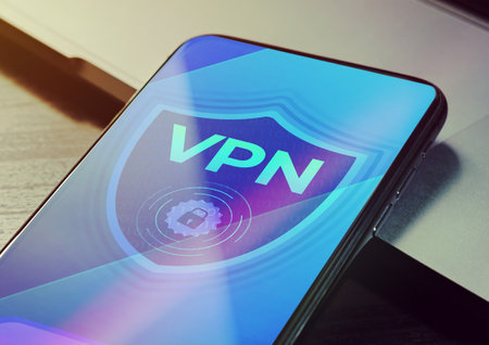 VPN - Virtual private network application for encrypt connection, anonymous internet using and unblock websites. Close up vpn security network sign logo on the smartphone screenの写真素材