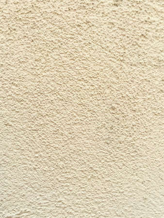 White textured background on the side of a building.の写真素材