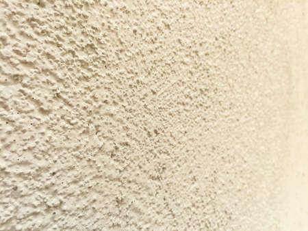 White textured  on the side of a building.の写真素材