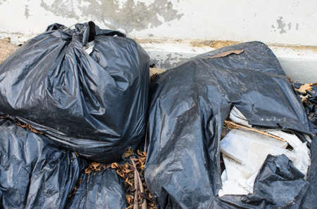 Black plastic garbage bagsの写真素材