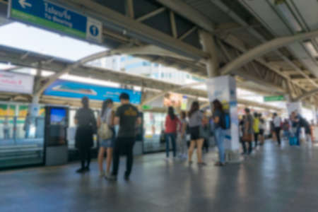Blurred background.People standing in lines waiting for BTS sky trainの写真素材