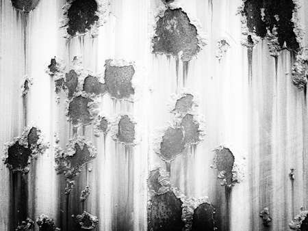 Cracked and peeled metal with rust textureの写真素材