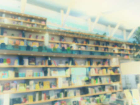 Vintage style color tone.Blur image of a bookstore .の写真素材