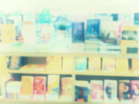Vintage style color tone.Blur image of a bookstore .の写真素材