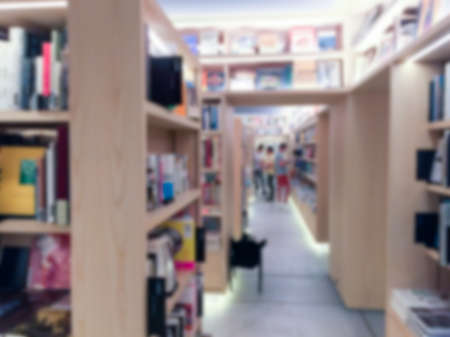 Vintage style color tone . Blur image of a bookstore .の写真素材