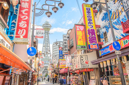 OSAKA , JAPAN - June 29 2018 :Tsutenkaku Tower. Tsutenkaku is a symbol of a new world in Osaka which was built in 1912. Tourists come enjoy restaurants and bars in this area .のeditorial素材
