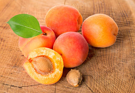 Apricots on the wooden backgroundの写真素材