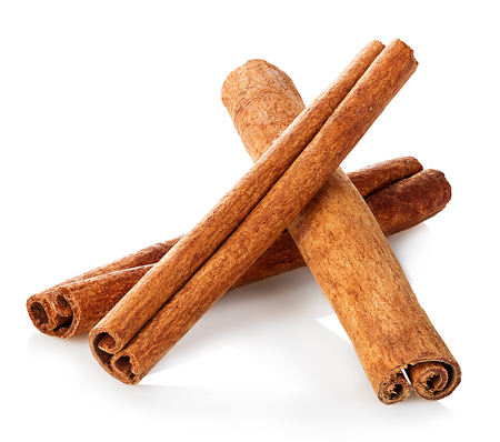 Cinnamon sticks close-up isolated on white background.の写真素材