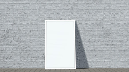 blank white frame in front of brick wall on wooden floor
