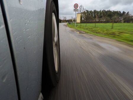 car driving on a asphalt road with motion blurrの写真素材