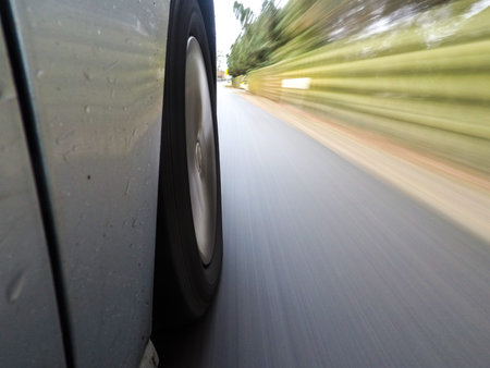 car driving on a asphalt road with motion blurr