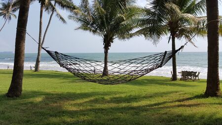 landscape of Hammock and the sea with coconut tree for relaxingの写真素材