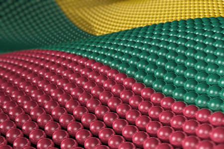 Wave of hundreds of glossy, reflective spheres with the colors of the flag of Lithuania. Shallow depth of field.の写真素材