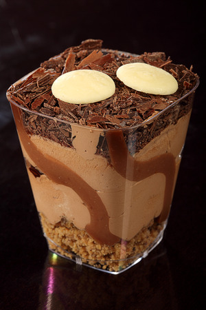 cream cake with chocolate and nutsの写真素材