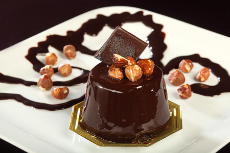 chocolate cream cake with nutsの写真素材