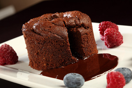 chocolate cream cake with raspberry decorationの写真素材