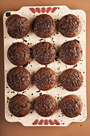 muffins with chocolate on the tableの写真素材