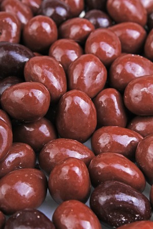 Dark and dairy chocolate balls. Chocolate drops as background texture pattern. Bon bons.の写真素材