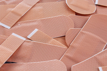 Adhesive plaster background. Medical photo texture pattern cover. Adhesive plasters studio photo....