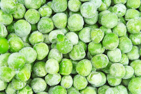 Frozen pea peases texture background. Green pease background pattern.