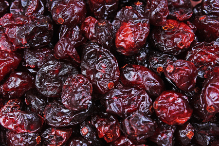 Red cranberry mullberry raisin dry fruit as texture pattern studio background. dry food.の写真素材