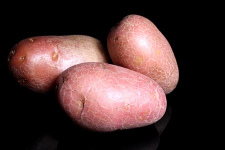 Potato potatos on black studio background. Food photos.の写真素材