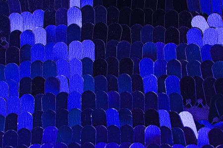 Fashion sequin design designer dress fabric cloth material. Sequins as background. Blue.
