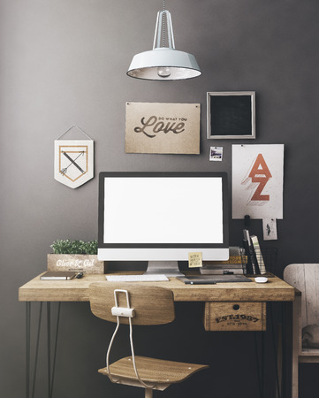 Stylish workspace with computer and posters on home or studioの写真素材