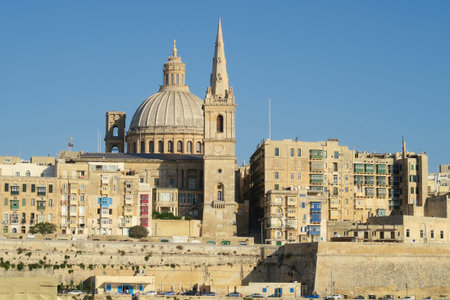 Valletta, Malta.  View of Basilica of Our Lady of Mount Carmel.  One of three cathedrals of the Anglican Diocese of Gibraltar in Europe St Paul's Pro-Cathedral tower is also visible.のeditorial素材