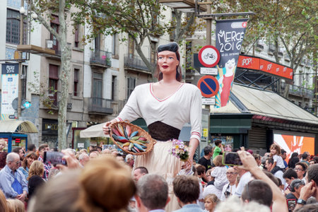 Barcelona, Spain - 24 September 2016 : La Merce annual festival Giants Parade. Each year during the feast oversized figures guided by humans parade spinning around the main streets of Barcelona.のeditorial素材