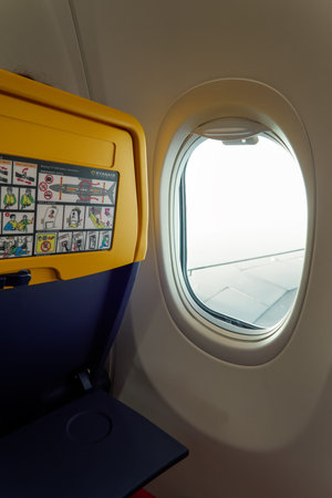New seat inside a Ryanair Boeing 737 800 aircraft with safety info card.