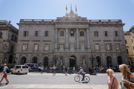 Barcelona, Spain City Hall view with crowd and police cars.  Casa de la Ciutat in the middle of...