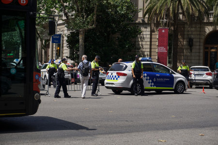 Barcelona, Spain police car blocking the traffic. Police car with police men of Guardia Urbana...