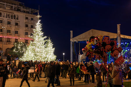 Thessaloniki, Greece Christmas 2018 decorations at Aristotelous square. Evening view of unidentified crowd around the main illuminated tree at the central city square.のeditorial素材