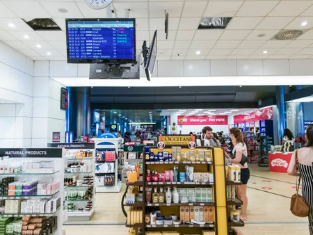 Thessaloniki, Greece SKG airport duty free shops with passengers. Unidentified people shopping at expanded &renovated area of Hellenic Duty Free Shops in Thessaloniki International airport Makedonia.のeditorial素材