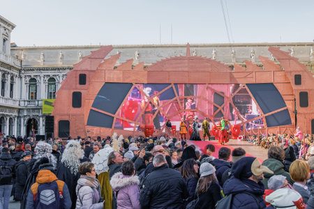 Venice, Italy carnival 2019 main stage ground view with crowd at Saint Mark square. Crowd at Piazza San Marco platform, designed by Massimo Checchetto for Missione Carnevale 19.のeditorial素材