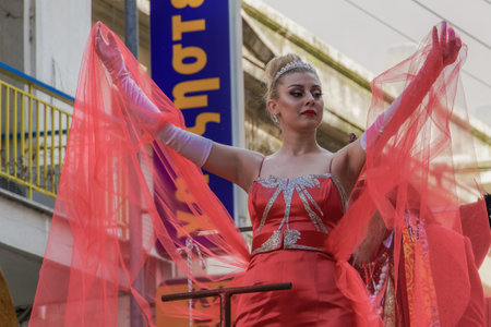 Xanthi, Greece Carnival Queen posing.Carnival Queen on a red dress waving at crowd aboard a parade float.のeditorial素材