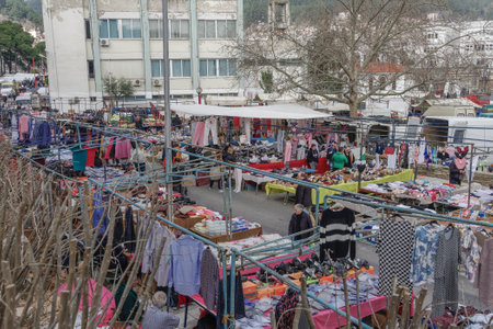 Street vendors selling products at large bazaar market in Xanthi, Greece.Open air street vendors selling clothes and other merchandise at stalls every Saturday at a weekly bazaar flea market.のeditorial素材
