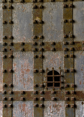 Medieval fortress Sant Elmo castle door in Naples, Italy. Detail of wooden and metal gate of big door leading inside Saint Elmo Castle on the hill of Vomero in Napoli.のeditorial素材