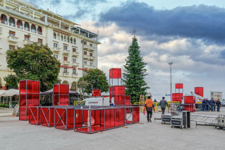 Thessaloniki, Greece Christmas preparations at Aristotelous square in the city center. Municipality crew working on installing festive houses, trees and decorations at main square.のeditorial素材