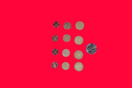 South African rand money coins top view. ZAR official currency of South Africa republic in denominations of bimetallic cent coins on red background.の写真素材