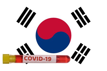 South Korea Coronavirus COVID-19 world outbreak concept. Vacutainer blood tube with 2019-nCoV virus positive sample before South Korean flag.の写真素材