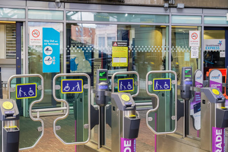 Manchester, UK airport train station entrance. Gates to Transpennine Express, Northern Rail & Metrolink coach connections at MAN airport terminal area.のeditorial素材