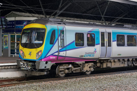 Manchester, UK airport train stopped at station. Transpennine Express at MAN airport terminal area...