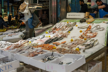 Thessaloniki, Greece Seafood counter with prices in Euros at Kapani covered market. Shops selling fresh raw fish arranged on ice in in the heart of the traditional city center.のeditorial素材